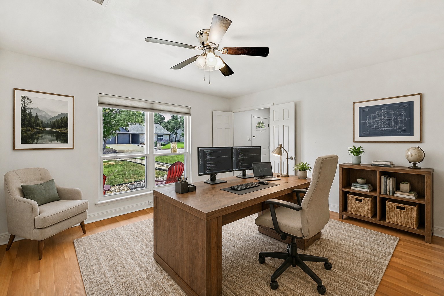 Home office with large desk and front yard view